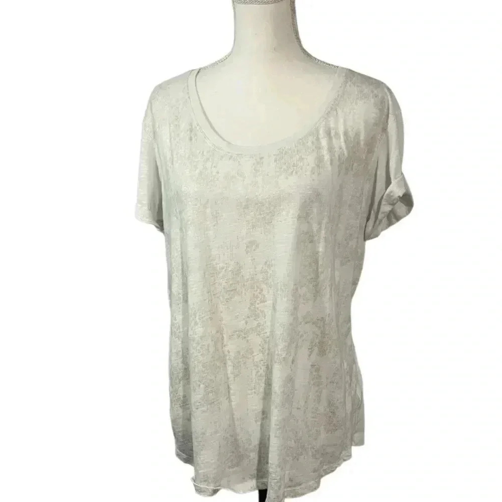 A New Approach size XL white tee with gold print on front and rolled sleeves EUC